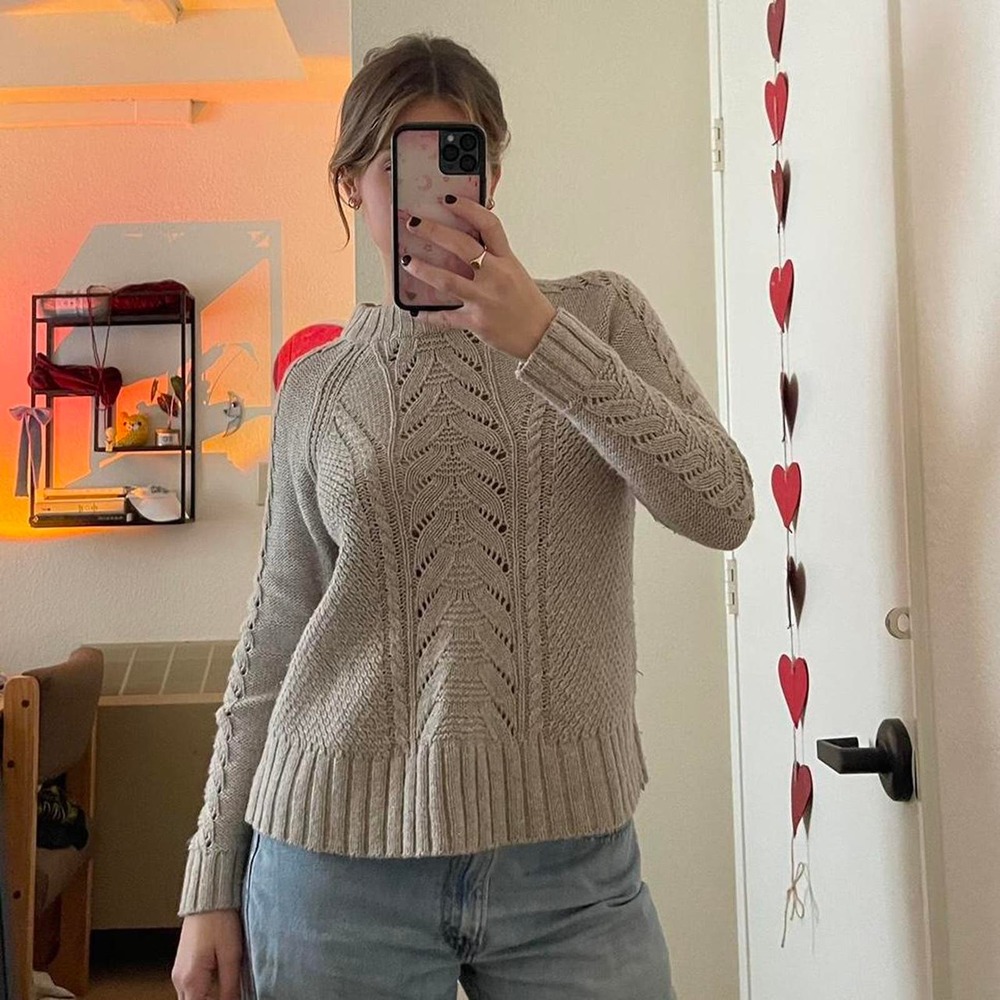The cream beige knitted sweater